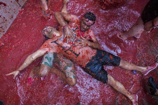 Revellers pay for Spain's annual tomato fight