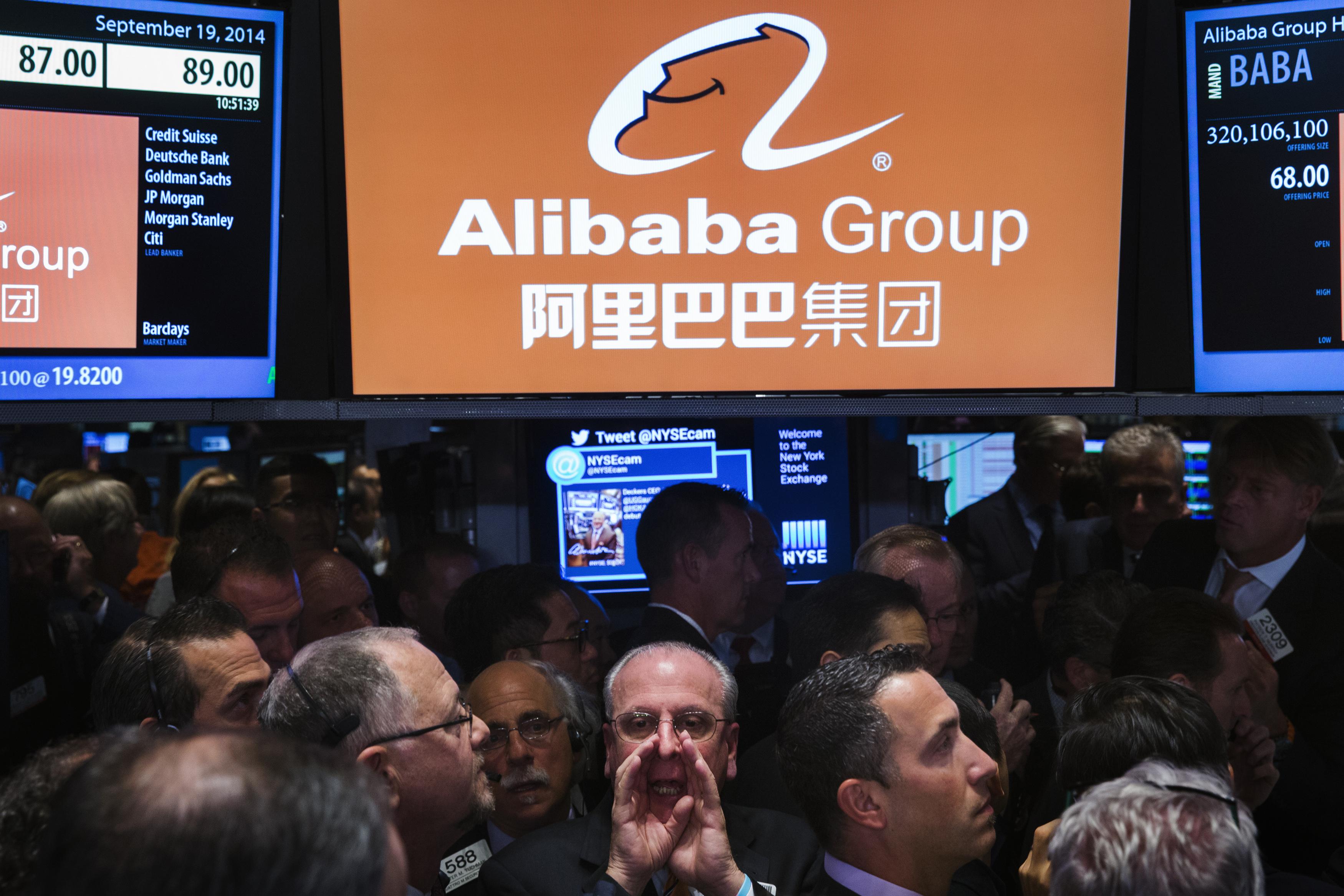 Dow hits new record; Alibaba soars in debut