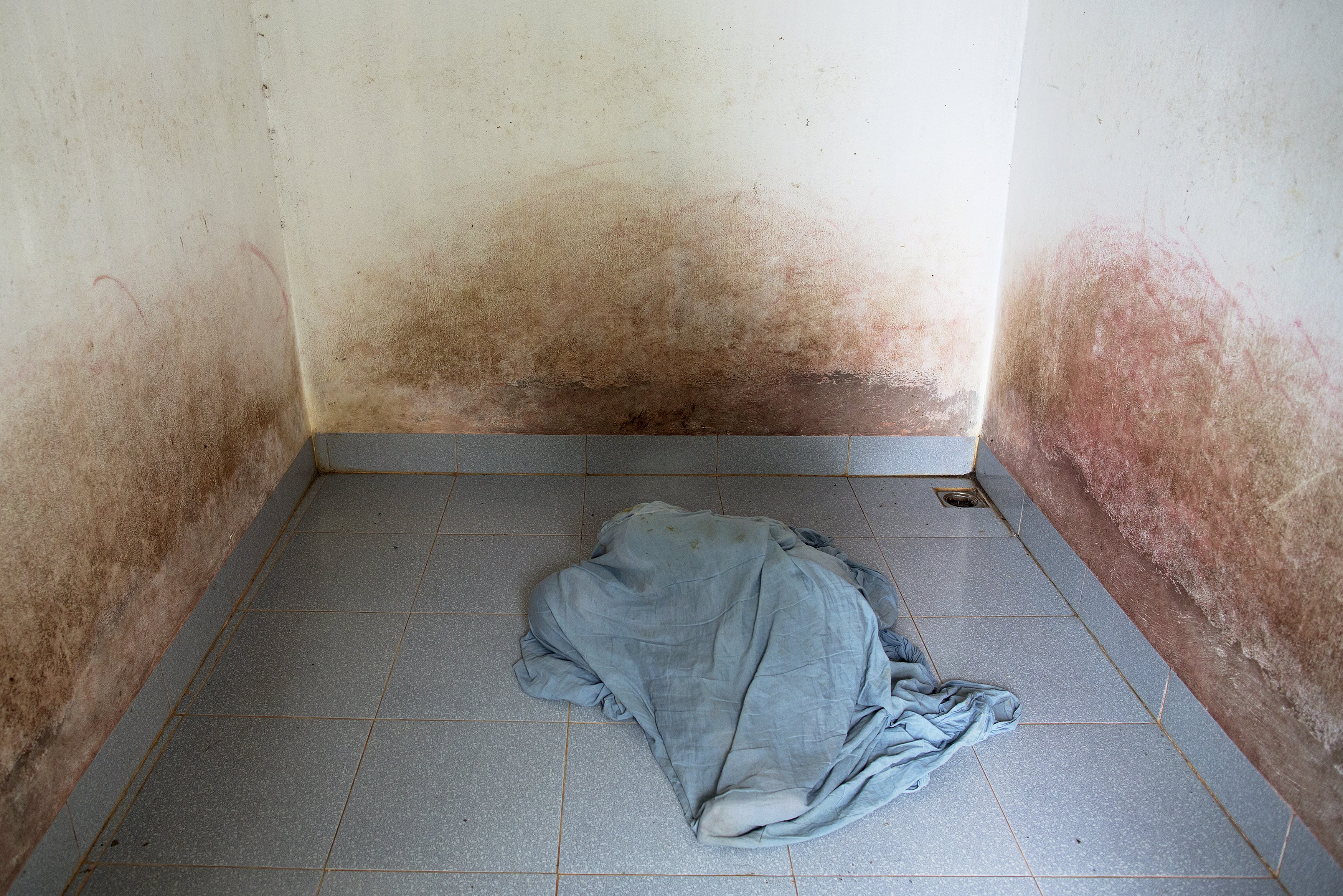 38-year-old Doan Thi Hong Gam, who suffers from severe mental as well as physical health problems, covers herself with a blanket in an empty room in Thai Binh province, northern Vietnam April 10, 2015. Doan Thi Hong Gam spends her time in an empty room. She is kept isolated because of aggressive behaviour linked to mental health problems. Her father, who suffers from serious heath problems, served as a Vietnamese soldier from the North during the war and said he was exposed to Agent Orange while fighting in the Central Highlands. Doan Thi Hong Gam’s family and health workers believe her health problems are linked to Agent Orange.