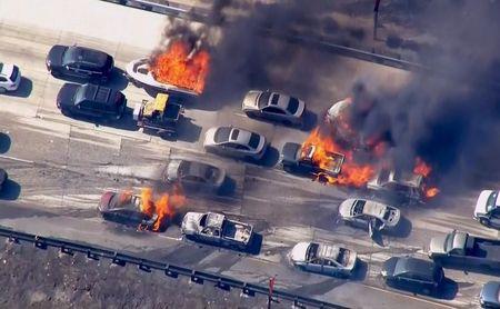 Wildfire overruns packed California freeway, burns cars