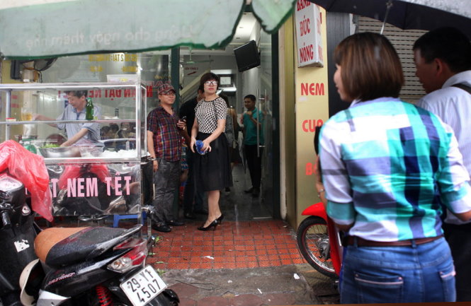 Despite the heavy rain, many people flock to the place for a dish of 'bun cha.'