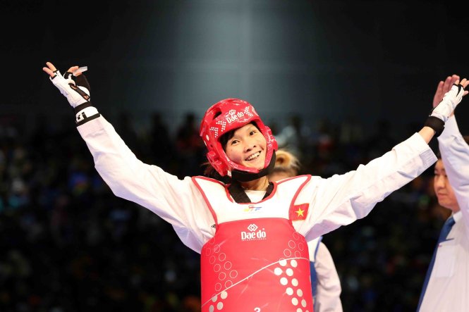 Vietnam's taekwondo martial artist Ha Thi Nguyen celebrates