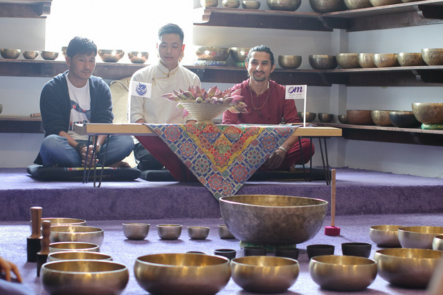 Men sit at a service center of Nguyen Manh Duy which offers treatment with Tibetan singing bowls in Ho Chi Minh City, Vietnam. Photo courtesy of Duy