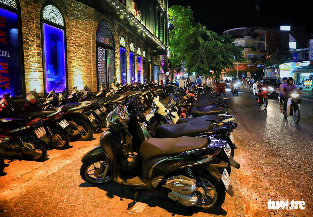 Motorcycles park in front of a karaoke bar on Duong Ba Trac Street in District 8, Ho Chi Minh City, Vietnam. Photo: Tuoi Tre