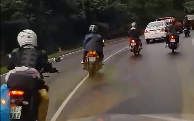 ​Bikers roar with wailing sirens, noisy mufflers on Vietnamese highway