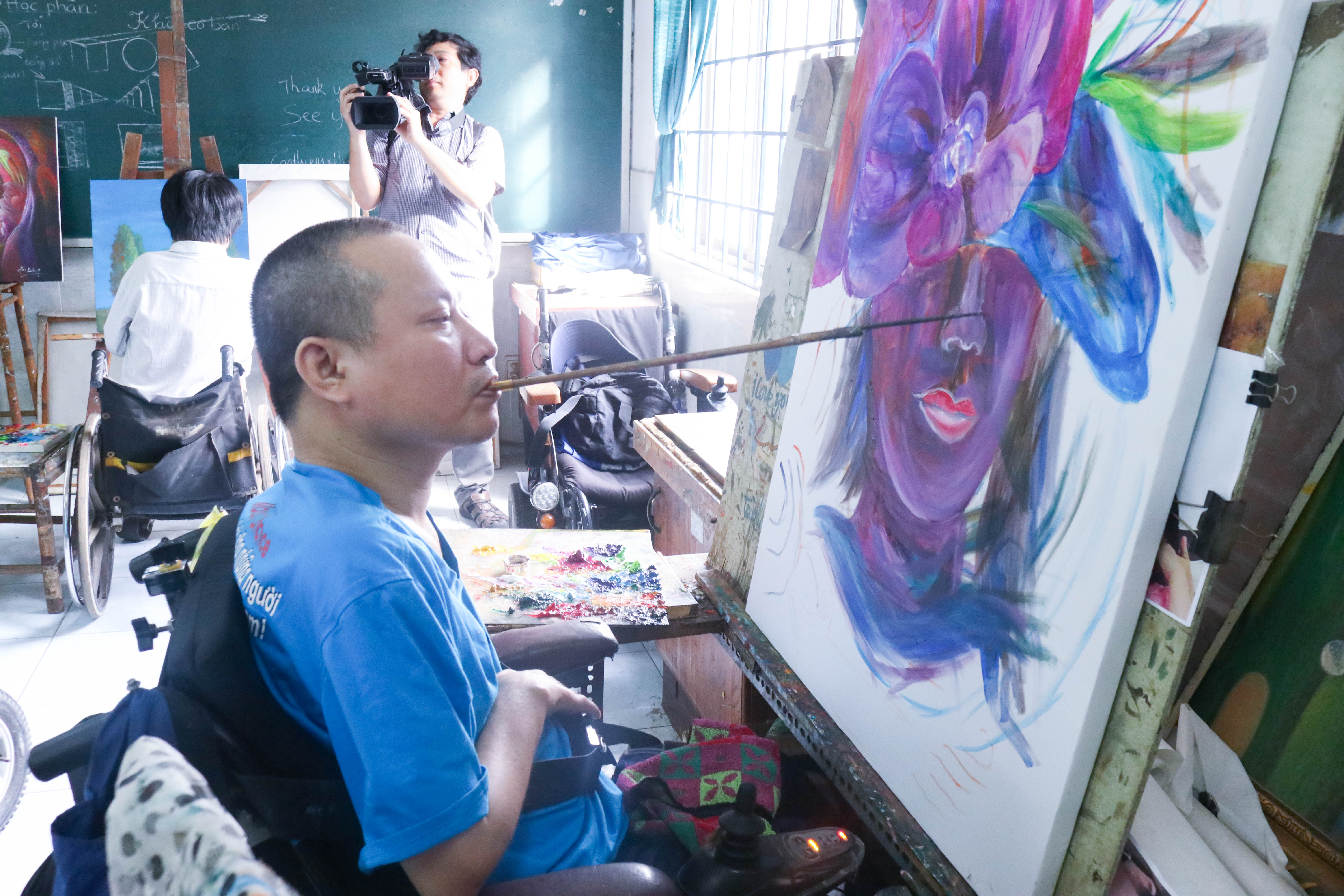 Handicapped residents of Maison Chance do not let their disabilities prevent them from painting for a living. Photo: Supplied