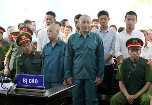 Defendants stand their trial October 31, 2018. Photo: Tuoi Tre