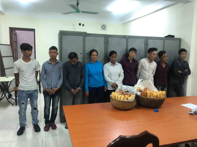 Nine suspects were summoned to the police station in Hoan Kiem District on November 1, 2018. Photo: Tuoi Tre