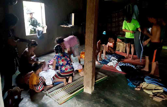 Kareng Penh’s family put on new clothes at their house in Thua Thien-Hue Province, central Vietnam. Photo: Tuoi Tre