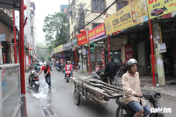 Shop signs along Dinh Thon Street in Hanoi, Vietnam. Photo: Tuoi Tre