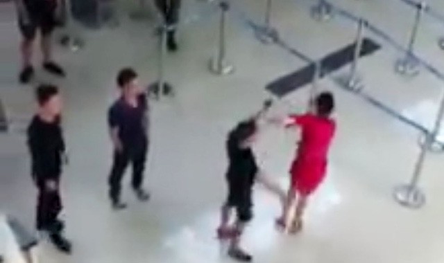 Vietnam police probe three men for attacking airline employee