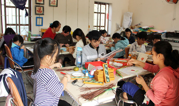 Nguyen Thi Thu Thuong’s employees at their workshop in Hanoi, Vietnam. Photo: Tuoi Tre