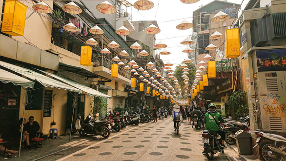 Vietnamese conical hats are hung over Dao Duy Tu Street in Hanoi. Photo: Tuoi Tre