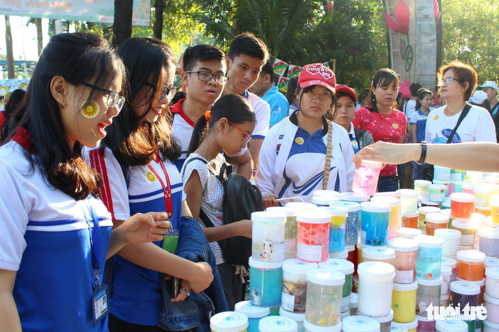 Young people shop for souvenirs at the fundraising fair.