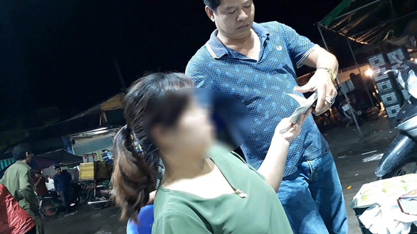 Duong Quoc Vuong collects protection money in the video footage previously published by the Vietnam Television (VTV).