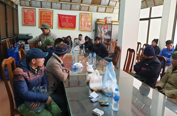 Smuggling arrestees are seen at a police station in northern Vietnam in this photo provided by police.