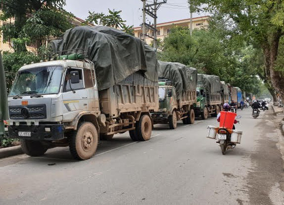 Trucks carrying contraband goods are seen in Lang Son Province, northern Vietnam, in this photo provided by police.