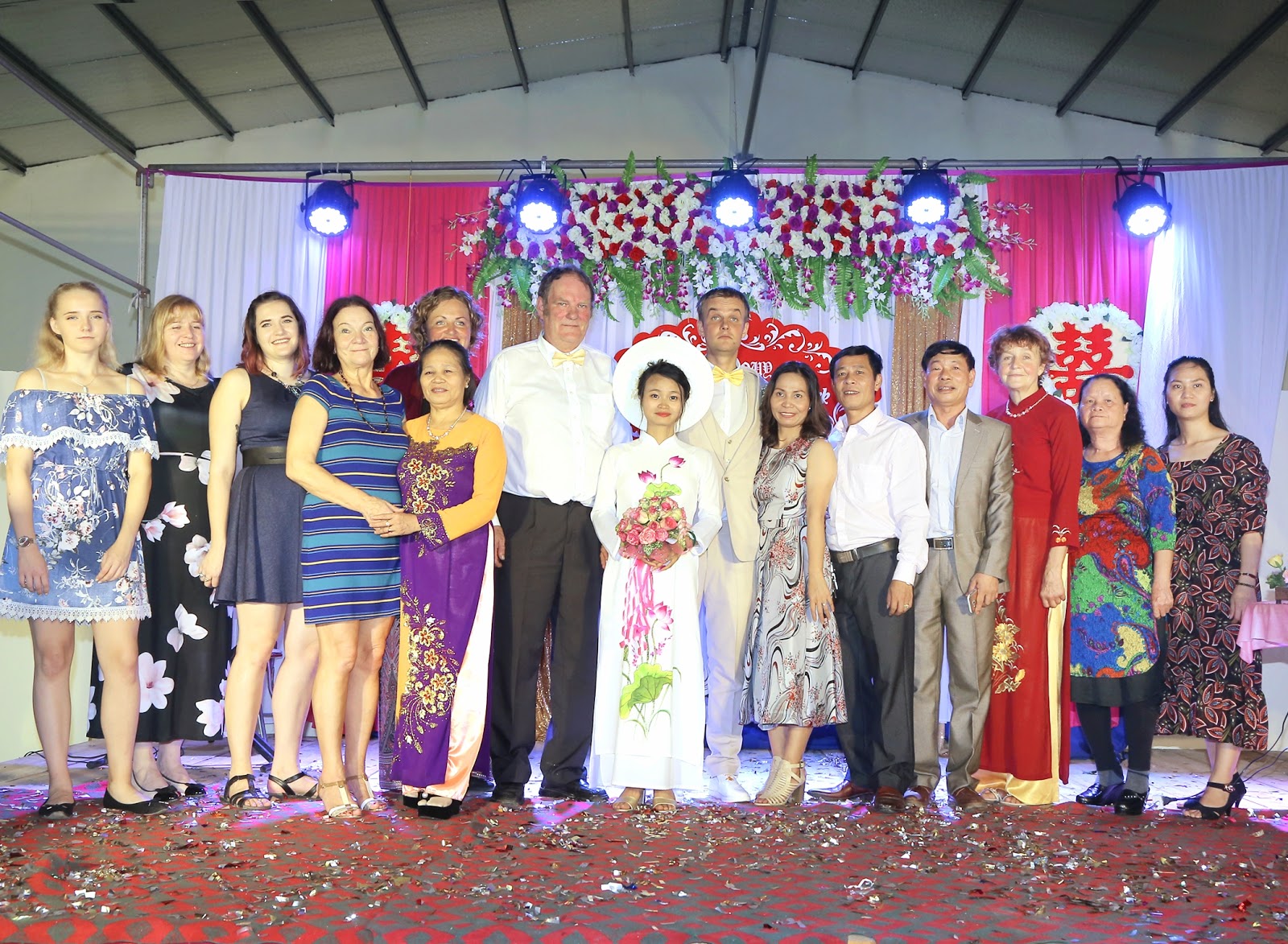 Nguyen Thi Sam, Meigo Mark and their families at the couple's wedding in a photo provided by Meigo Mark