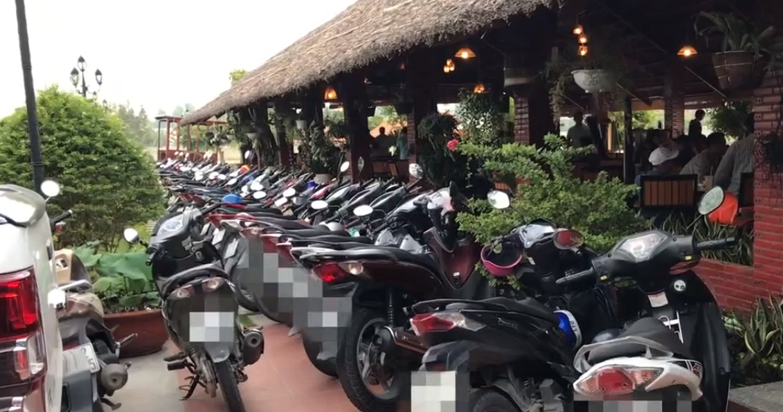 Motorbikes fill the parking lot at a Long An restaurant before the competition kicks off . Photo: Tuoi Tre