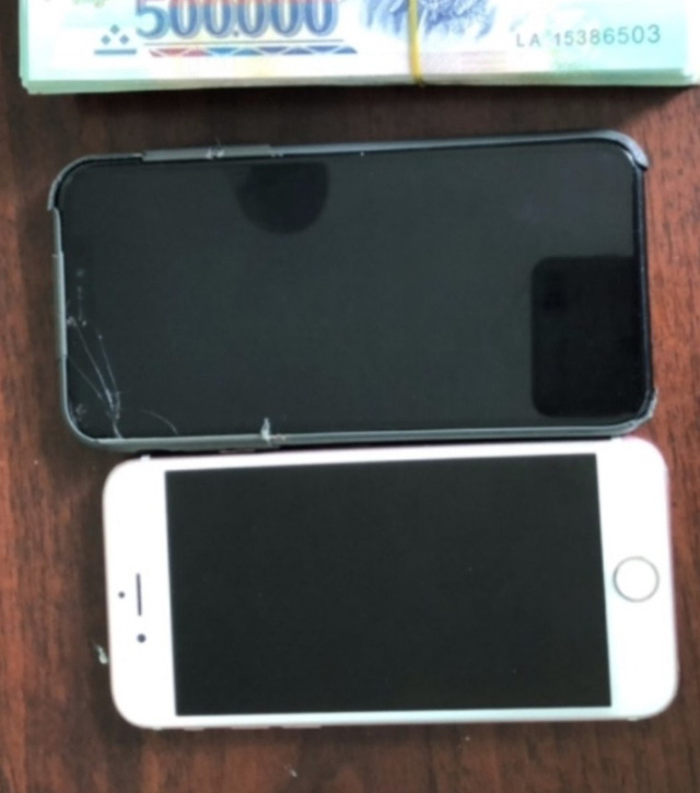 A photo provided by police shows the money and phones returned