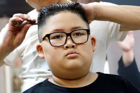 To Gia Huy, 9, has a haircut in a North Korean leader Kim Jong Un style in a haircut salon in Hanoi, Vietnam February 19, 2019. Photo: Reuters