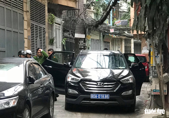 Police search the house of former Minister of Information and Communications Truong Minh Tuan in Hanoi. Photo: Danh Trong / Tuoi Tre