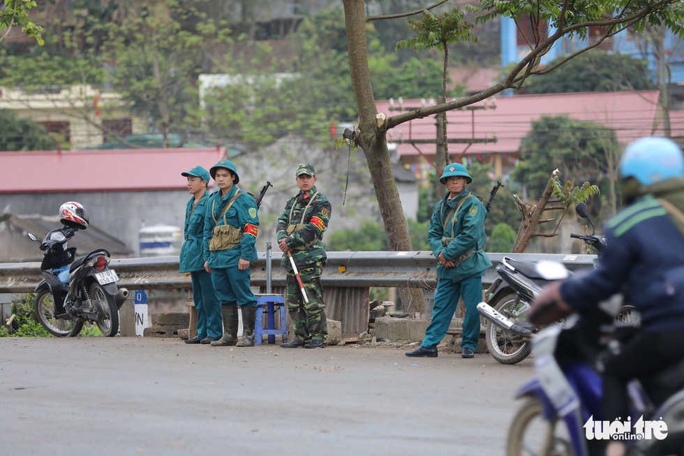 Soldiers and militiamen stand guard along a road leading to Dong Dang Railway Station in Lang Son Province, northern Vietnam, February 25, 2019. Photo: Viet Dung / Tuoi Tre