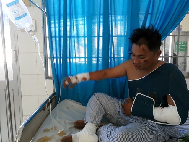 Do Thanh An sits on a bed at a hospital in Ba Ria-Vung Tau Province, southern Vietnam, March 10, 2019. Photo: Dong Ha / Tuoi Tre
