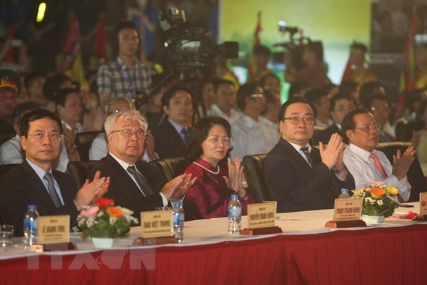 High-ranking officials of Hanoi applaud to the performance during the celebration of 1080 years freedom from the Chinese at Imperial Citadel Co Loa in Hanoi on April 20, 2019. Photo: Vietnam News Agency
