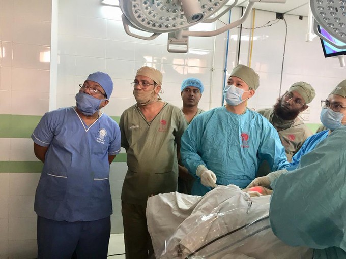 A Vietnamese doctor Phan Hoang Hiep (fourth from left), a doctor at National Hospital of Endocrinology, operates on a patient during a model operation he did for 110 Bangladesh doctors. Photo: Supplied
