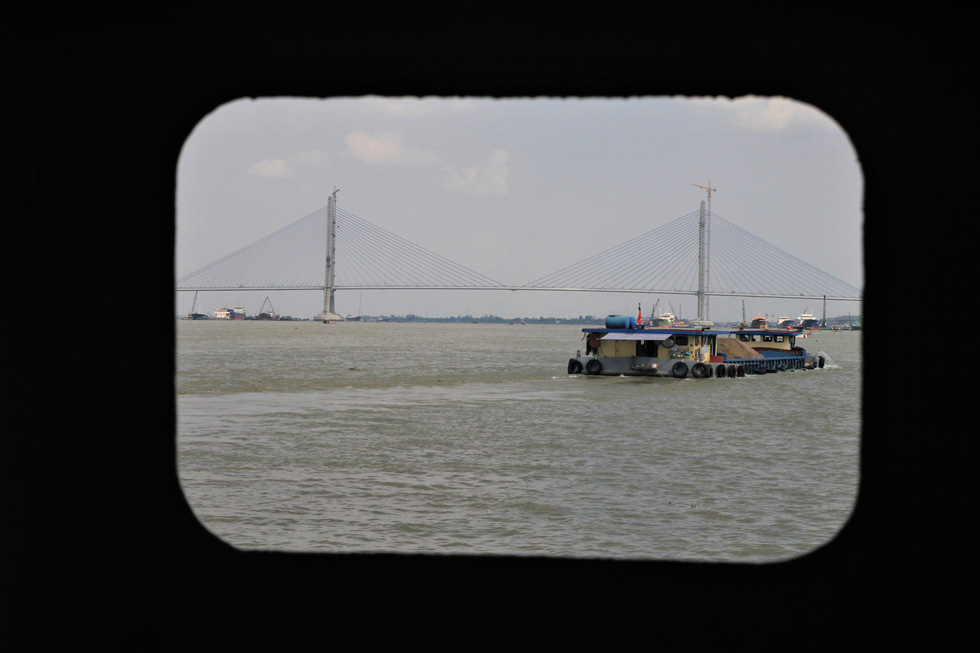 Vam Cong Bridge is pictured from a ferry along the Hau (Back) River.