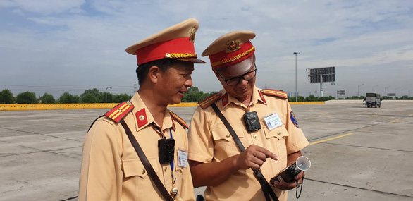 Officers are fitted with body-worn cameras. Photo: Giang Long / Tuoi Tre