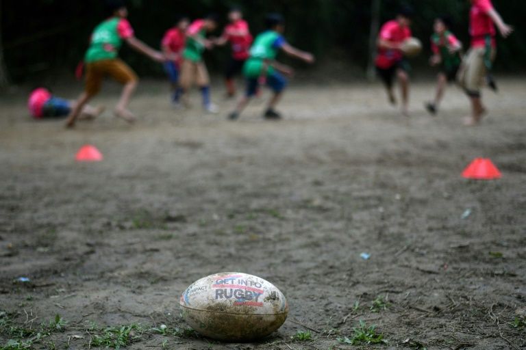 Many of the players are barefoot and they train on a makeshift pitch. Photo: AFP