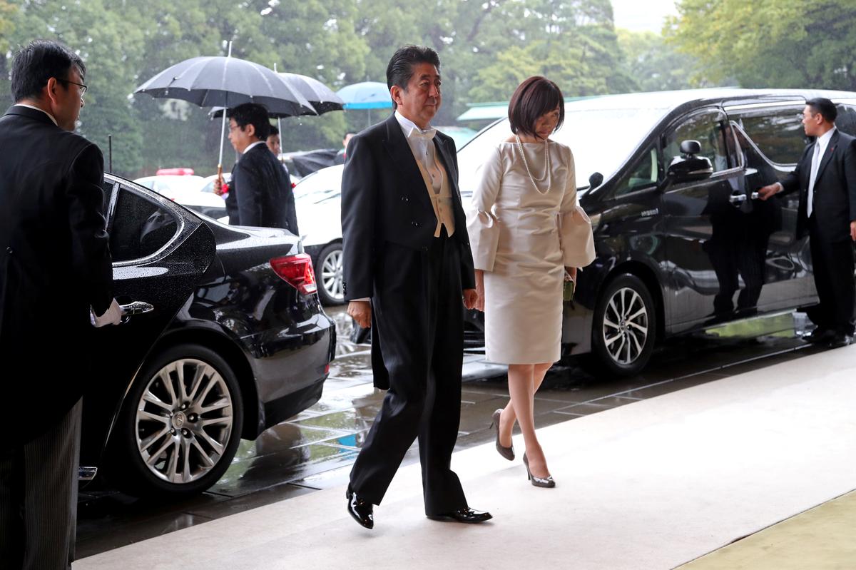 Japan's Prime Minister Shinzo Abe and his wife Akie arrive at the Imperial Palace to attend the proclamation ceremony of the enthronement of Japan's Emperor Naruhito in Tokyo, Japan, October 22, 2019. Koji Sasahara/Pool via REUTERS