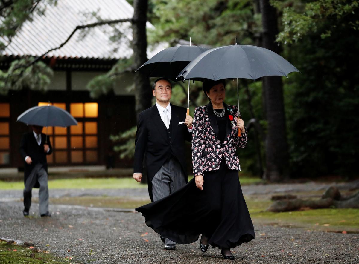 Tokyo Governor Yuriko Koike arrives at the ceremony site where Japan's Emperor Naruhito will report the conduct of the enthronement ceremony at the Imperial Sanctuary inside the Imperial Palace in Tokyo, Japan October 22, 2019.  REUTERS/Kim Hong-ji