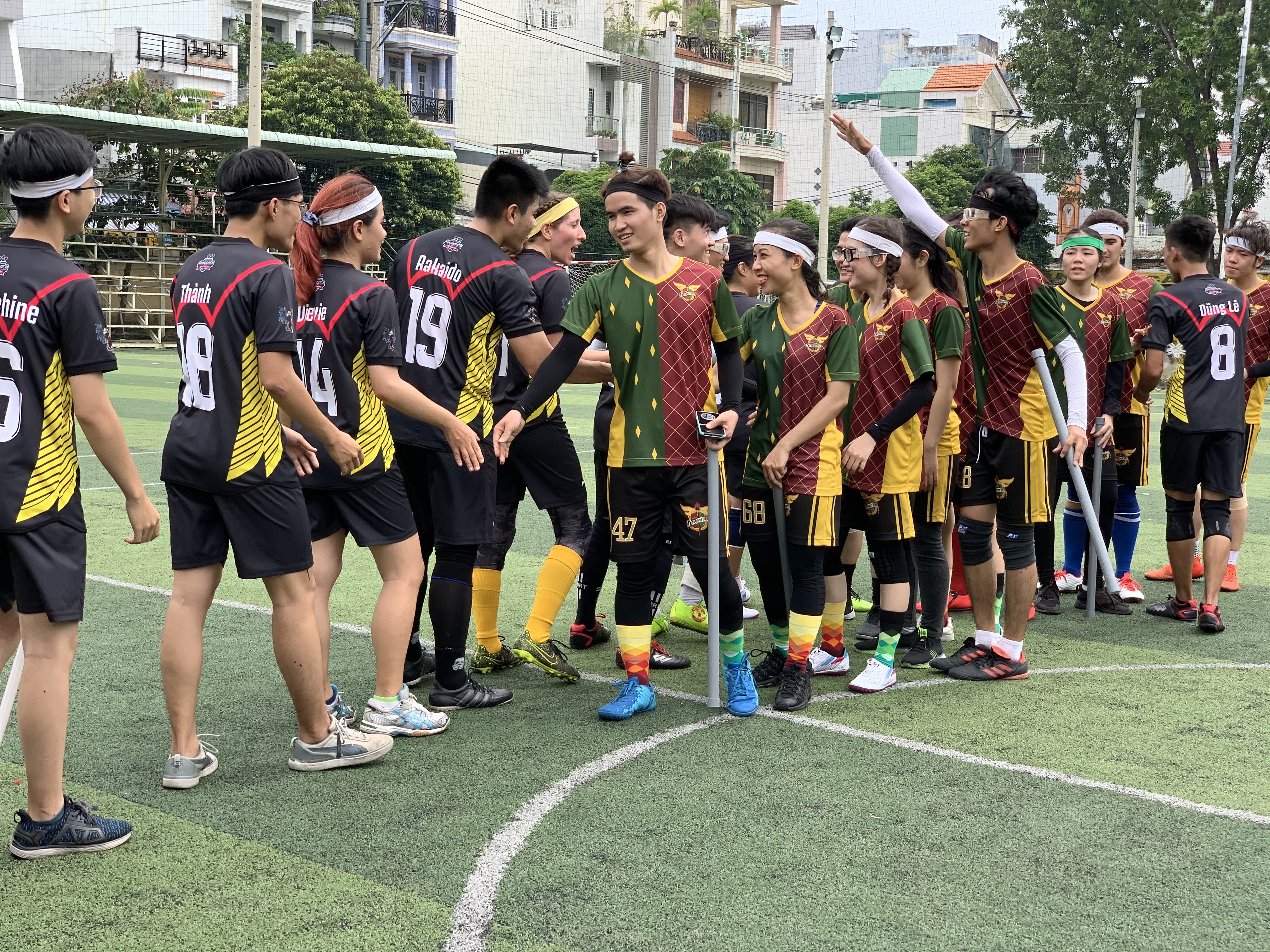 Players shake hand after a match in the maiden Vietnam Quidditch Cup organized by the Vietnam Quidditch Association  in Tan Binh District, Ho Chi Minh City, November 10, 2019. Photo: Bao Anh / Tuoi Tre News