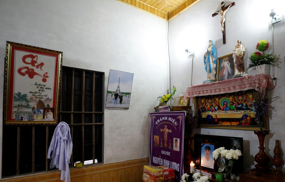 Images of Nguyen Dinh Luong, a victim who was found dead in the back of British truck, are seen at his home after his funeral in Ha Tinh Province, Vietnam November 29, 2019. Photo: Reuters