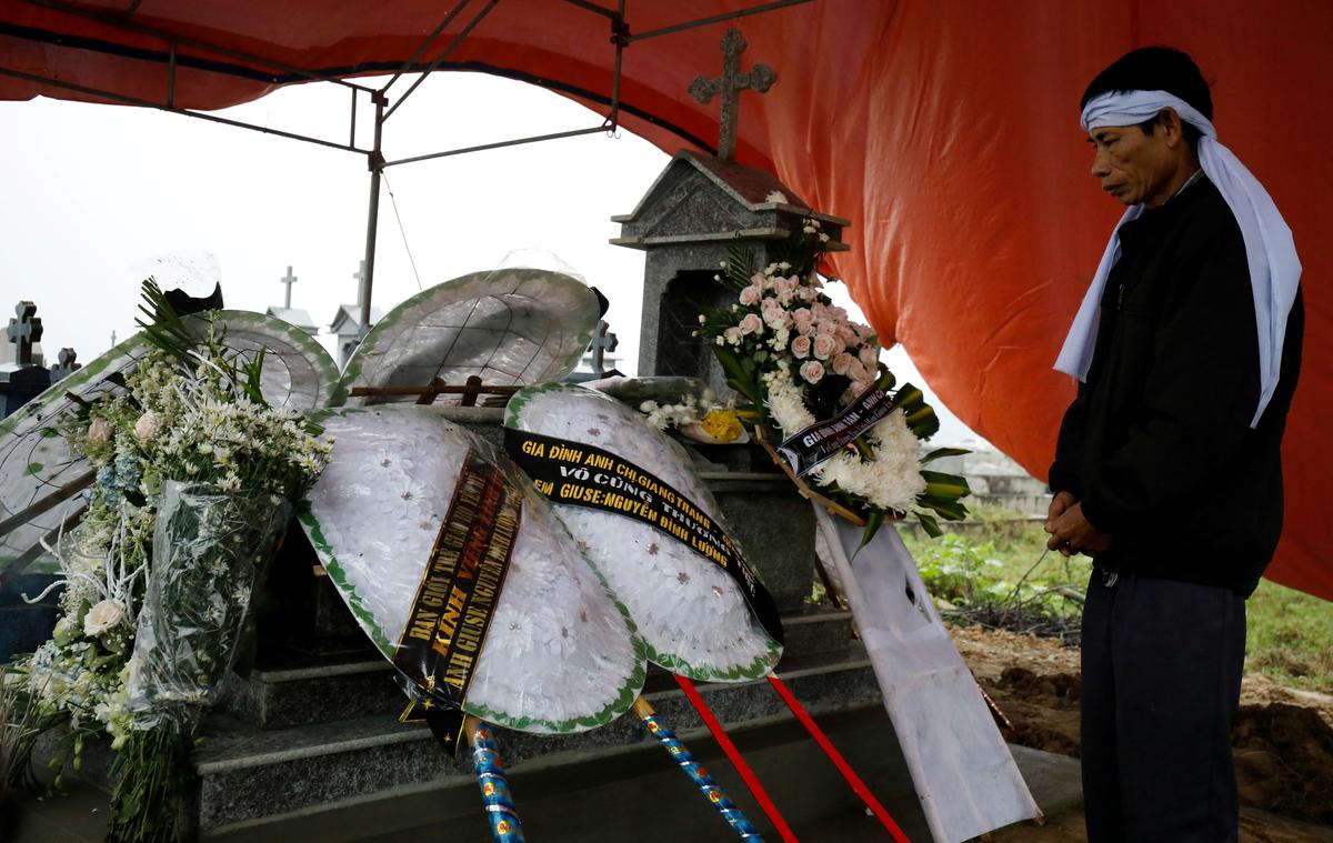 Nguyen Dinh Gia visits the newly built grave of his son Nguyen Dinh Luong, a victim who was found dead in the back of British truck, at the homeland cemetery in Ha Tinh Province, Vietnam November 29, 2019. Photo: Reuters
