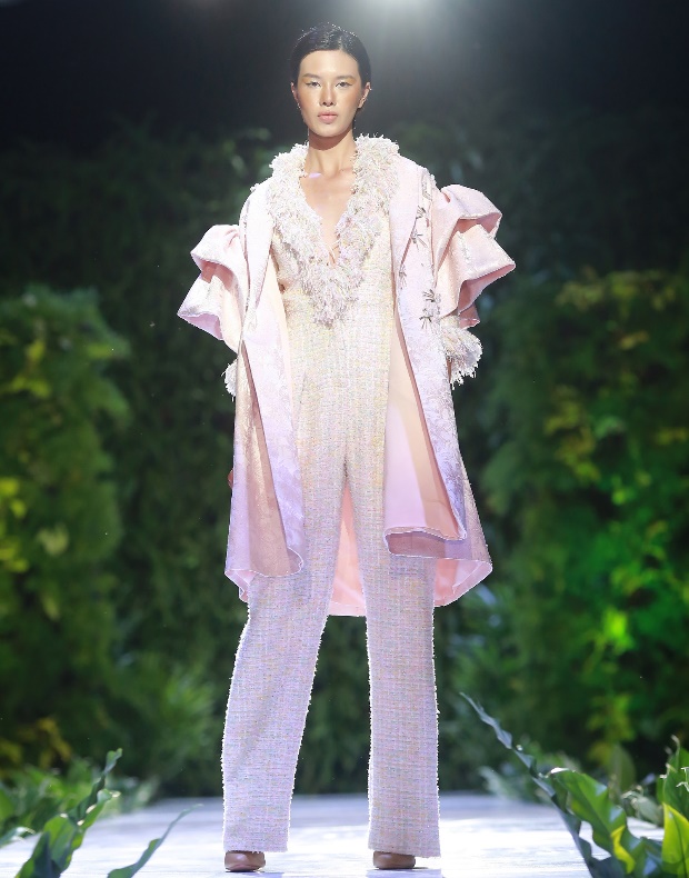 A jump suit with handmade fringing and statement coat with hand-sawn embellishment is presented at a Yaly fashion show in Hoi An City, Quang Nam Province, Vietnam on November 30, 2019. Photo: Yaly
