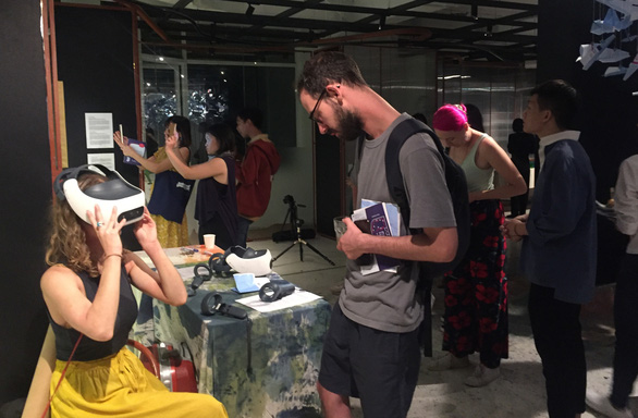 Visitors experience an augmented reality installation on display at the 'You can talk to me' exhibition in Ho Chi Minh City on December 6-14, 2019. Photo: Mai Thuy / Tuoi Tre