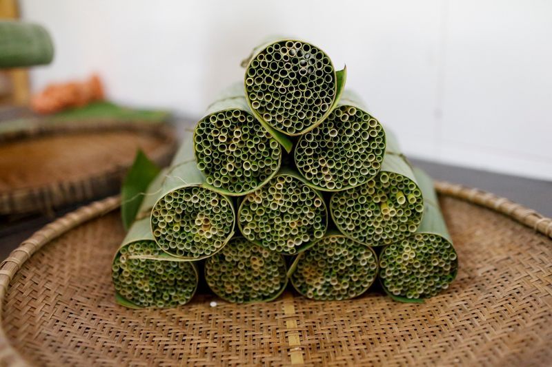 Grass straws are packed at the 3T workshop in Long An province. Photo: Reuters