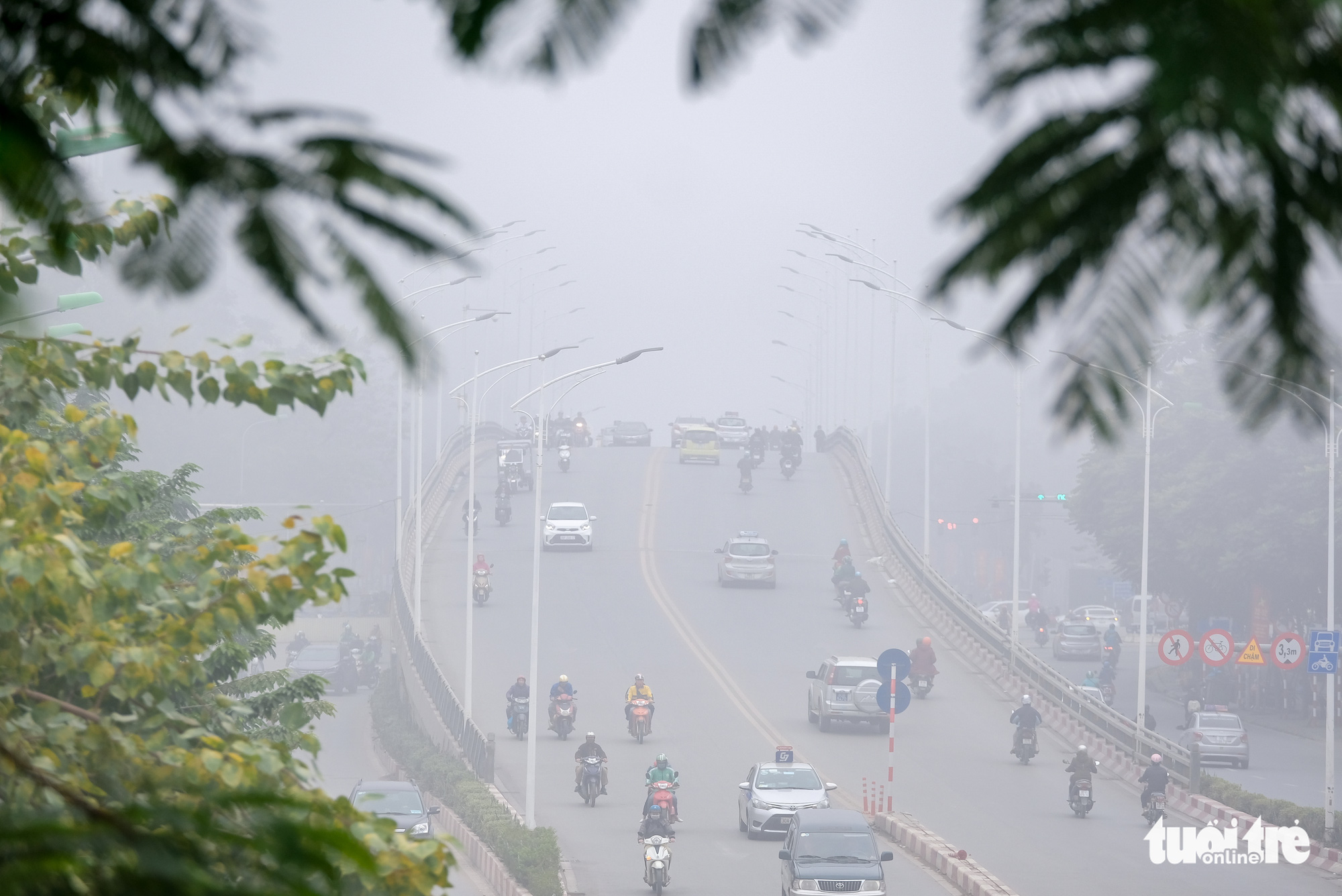 Commuters travel on Nguyen Chi Thanh overpass in Hanoi on the morning of December 24, 2019.
