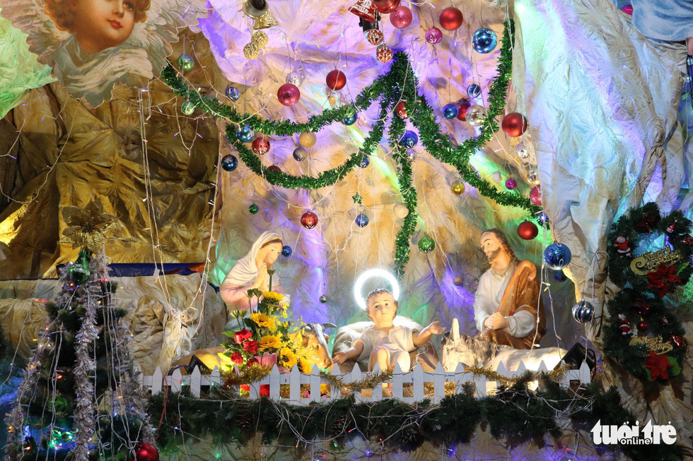 A nativity scene is illuminated and equipped with captivating ornaments at the Tu Dinh parish in Go Vap District, Ho Chi Minh City. Photo: Khanh Tran / Tuoi Tre