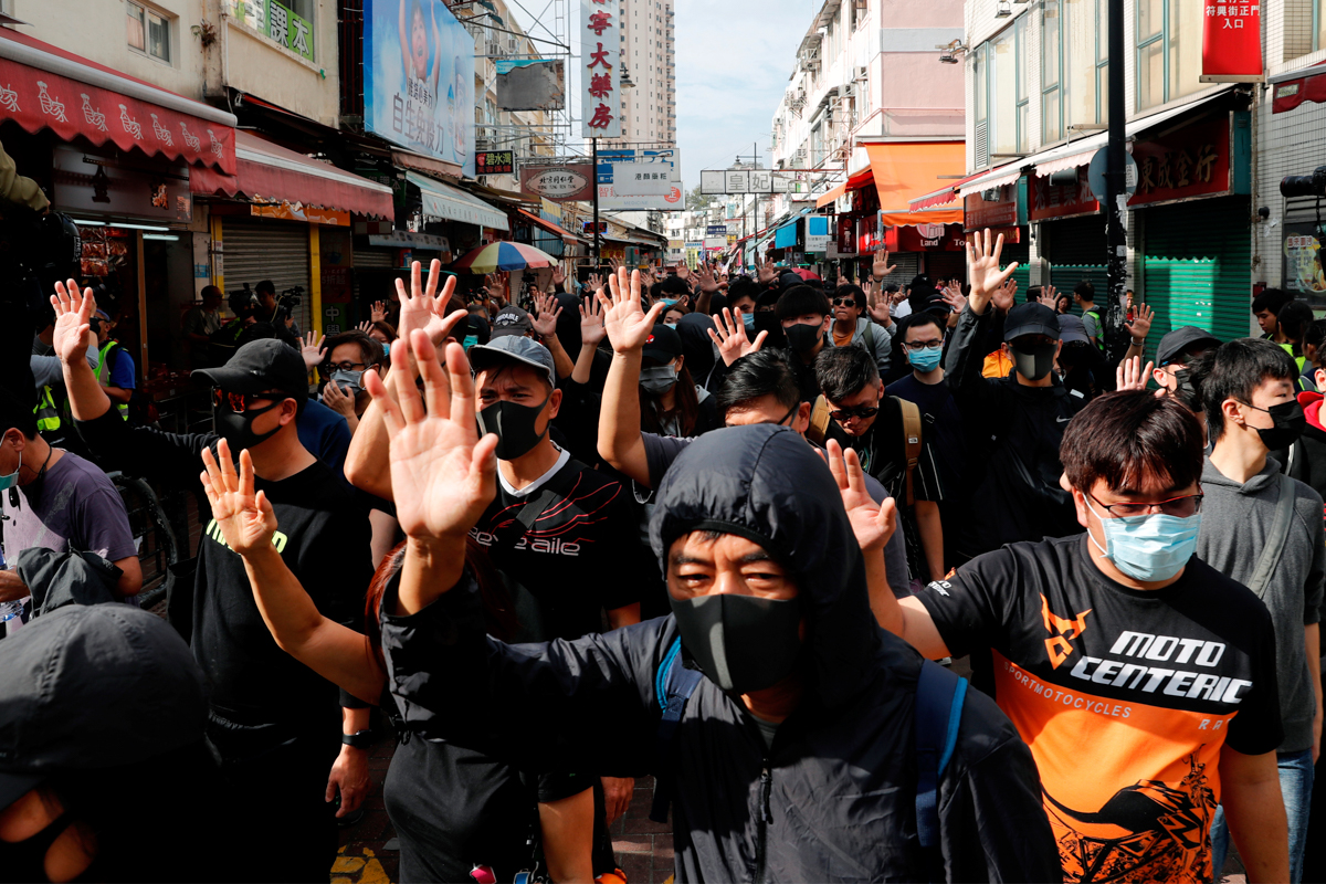 Dozens arrested after Hong Kong protest taking aim at Chinese traders