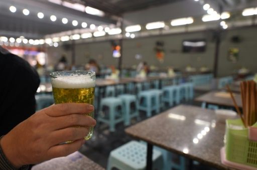 Many Vietnamese stop off at their favourite bar for a few glasses of beer after work. Photo: AFP