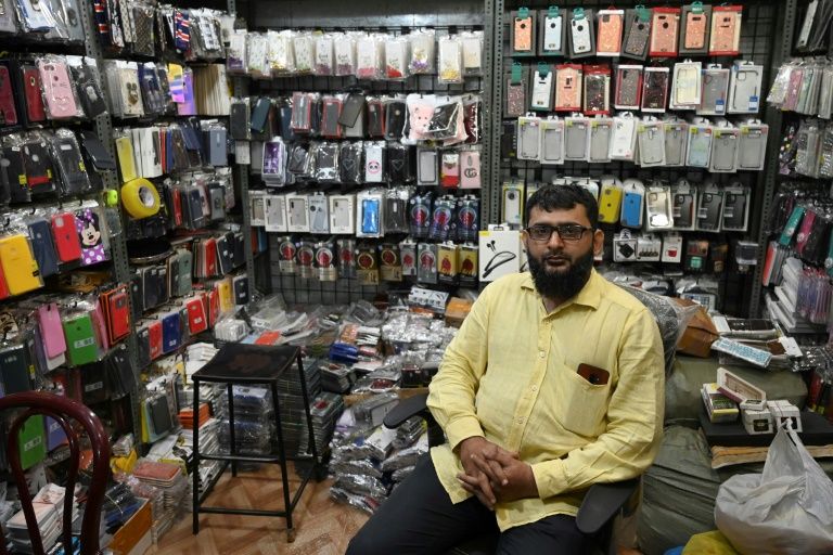 Mumbai shopkeeper Aslam Malkani poses on January 27, 2020. Photo: AFP