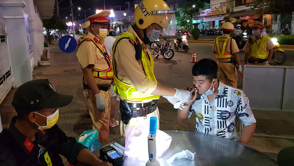 In Vietnam, drivers take breath tests by blowing into balloons amidst coronavirus scare