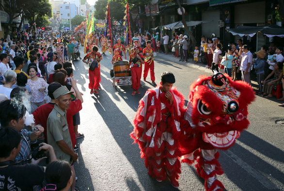 <em>People perform a lion dance at the First Full Moon Festival, or Tet Nguyen Tieu, on a street in District 5, Ho Chi Minh City.</em>