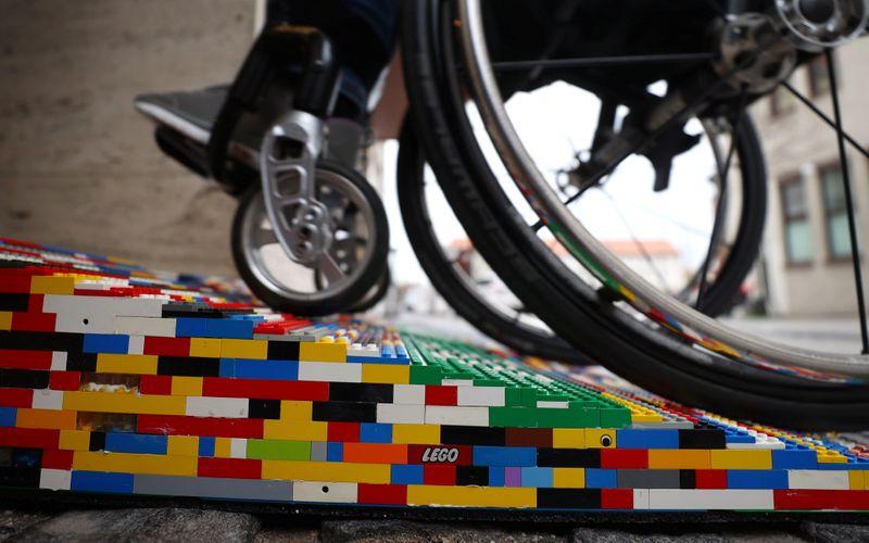 Rita Ebel, nicknamed 'Lego grandma,' tests one of her wheelchair ramps built from donated Lego bricks in Hanau, Germany, February 17, 2020. Picture taken February 17, 2020. Ebel started to build the ramps almost one year ago to raise awareness for handicapped people in her hometown of Hanau. Meanwhile, dozens of stores use the ramps to ease entry for wheelchair users.  Photo: Reuters