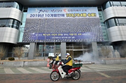 Workers spray disinfectant outside the Shincheonji church in the South Korean city of Daegu after members fell ill with the novel coronavirus. Photo: AFP